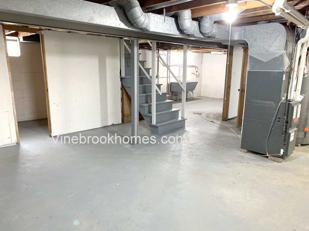 a set of stairs going up to a loft in a building