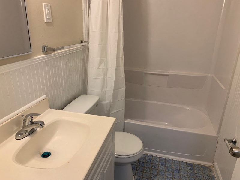 a bathroom with a sink toilet and a tub
