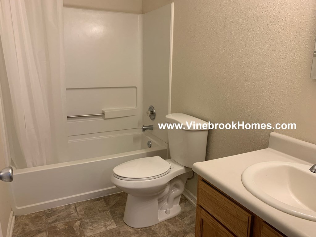 a bathroom with a toilet and a sink