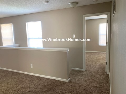 a small living room and a dining room with a table
