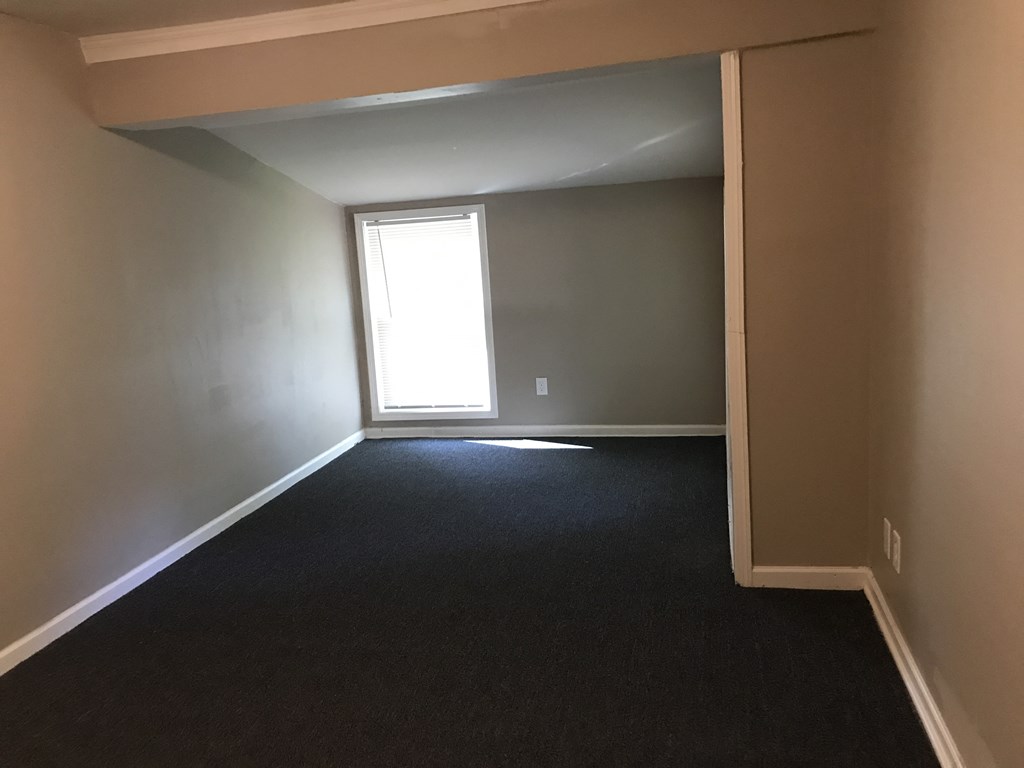 an empty room with a window in it