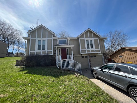 a house with a car parked in front of it