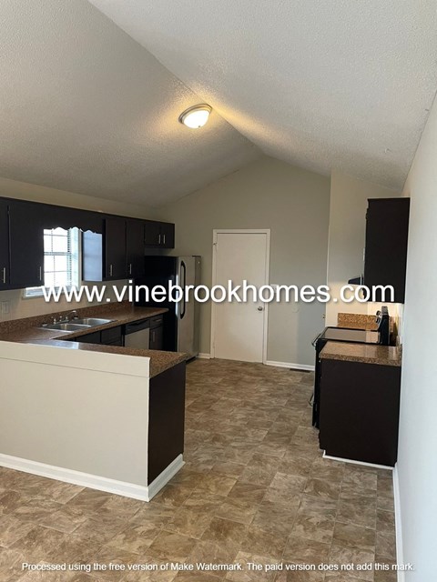 A kitchen with a counter and cabinets.