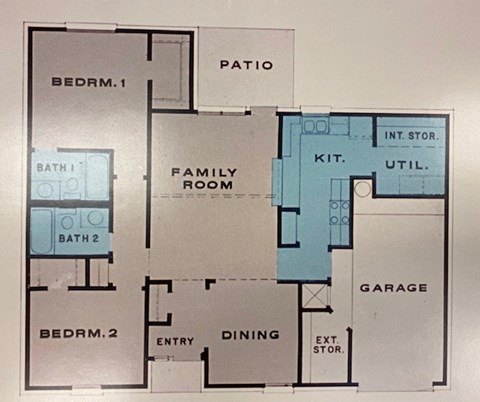 A floor plan of a house with two bedrooms, a family room, a garage, and a dining area.