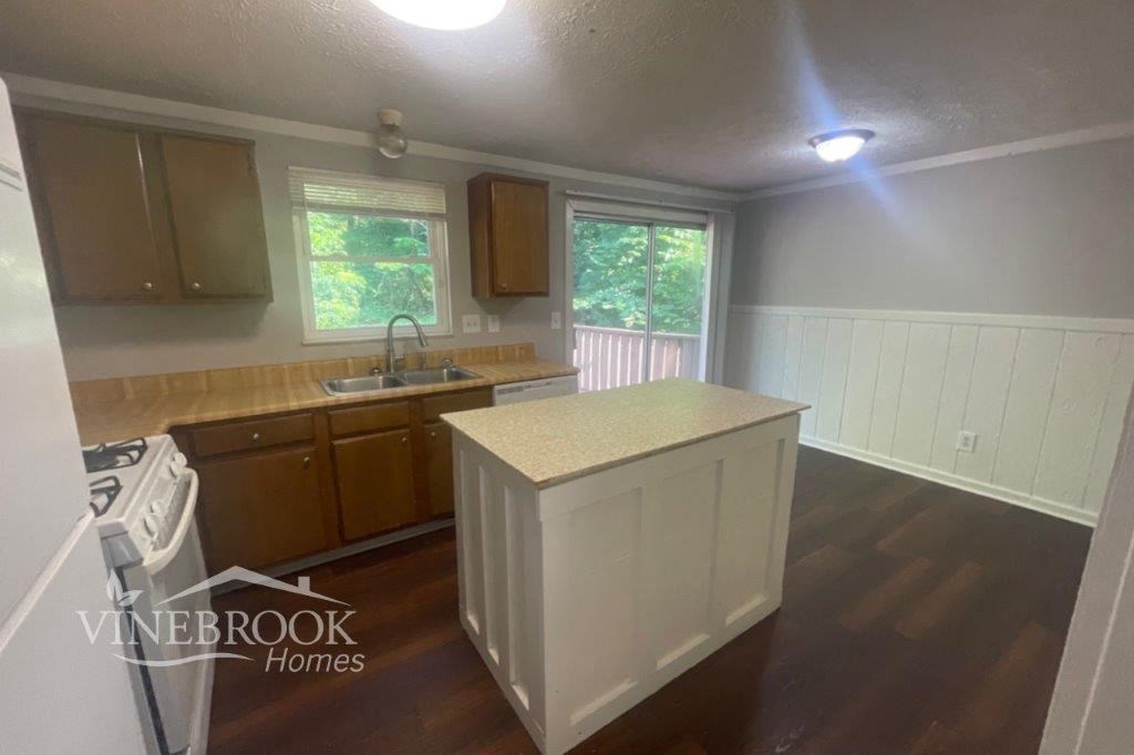 a kitchen with a counter top and a sink