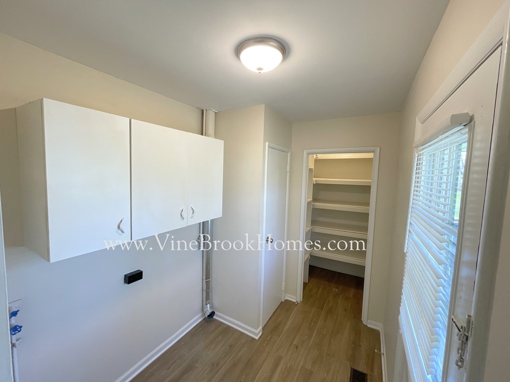a mirrored closet in the bedroom of this renovated house