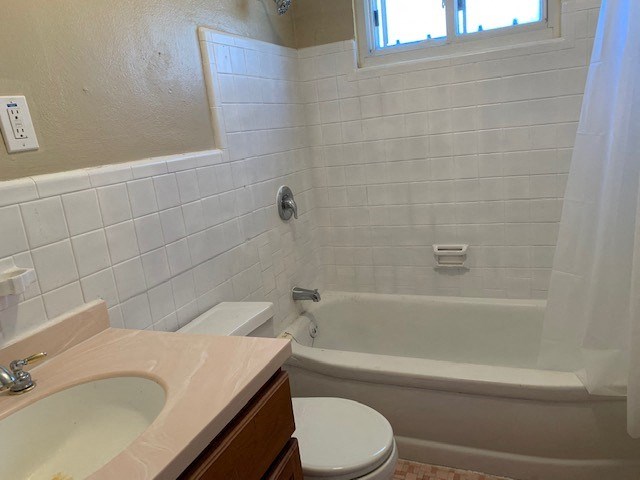 a bathroom with a sink toilet and a bath tub