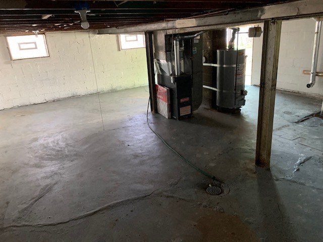 a garage with a water stain on the floor