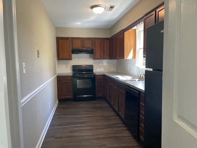 a kitchen with a stove and a sink