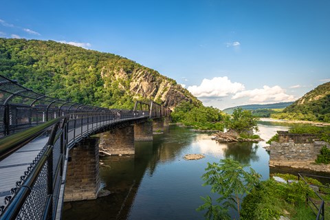 a train crossing a bridge over a river