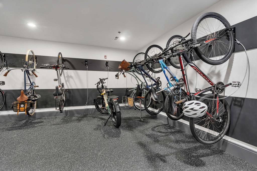 A bike shop with bikes hanging on the wall.