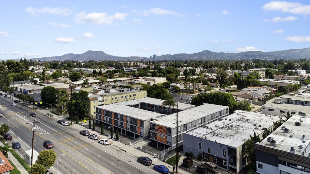 A city street with cars and buildings.