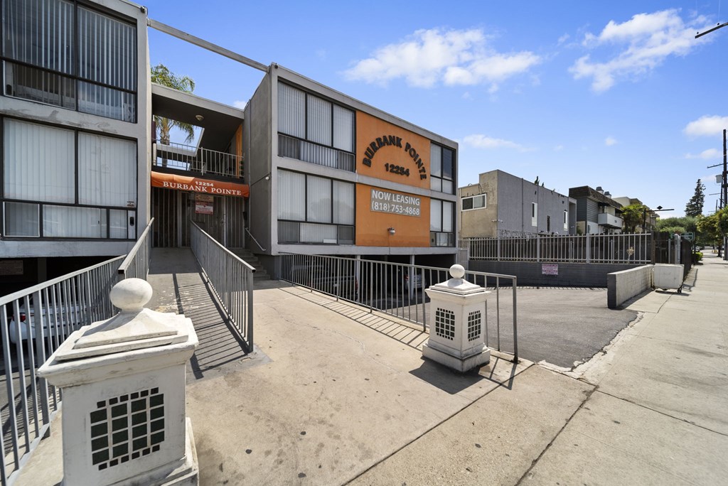 A view of a street with a building that has a sign that says "Borough Police".