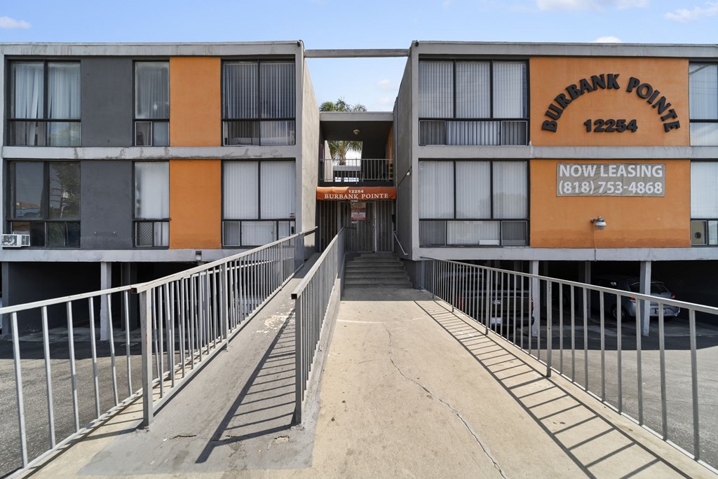 A Burbank Pointe sign is on the side of a building.