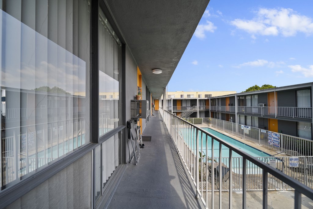 A balcony with a bicycle parked on it.