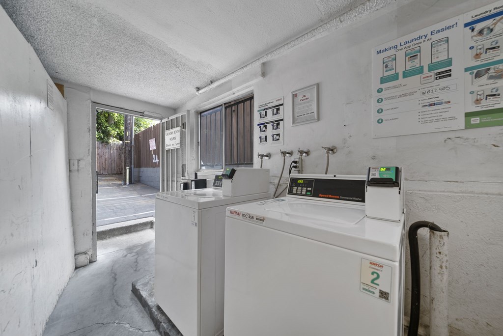 A white washing machine with a sticker on it.