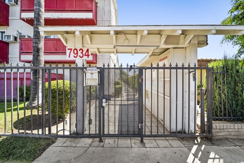 A gate with the number 7934 on it is closed.