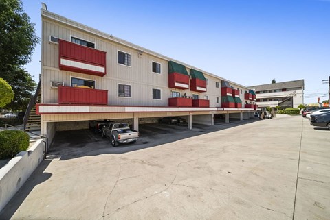 A large white building with red and green accents.