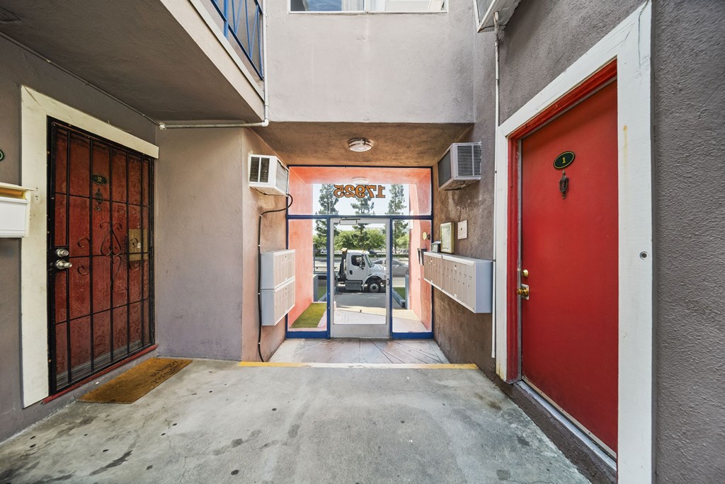 A red door is on the right side of the image.