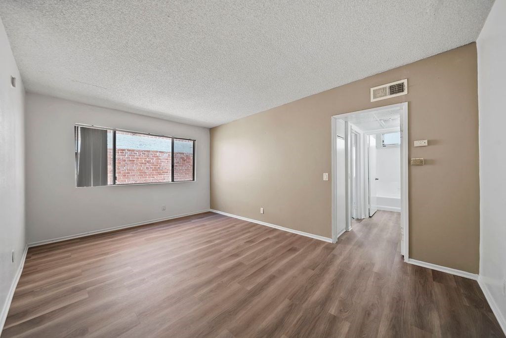 A room with a window and a door.