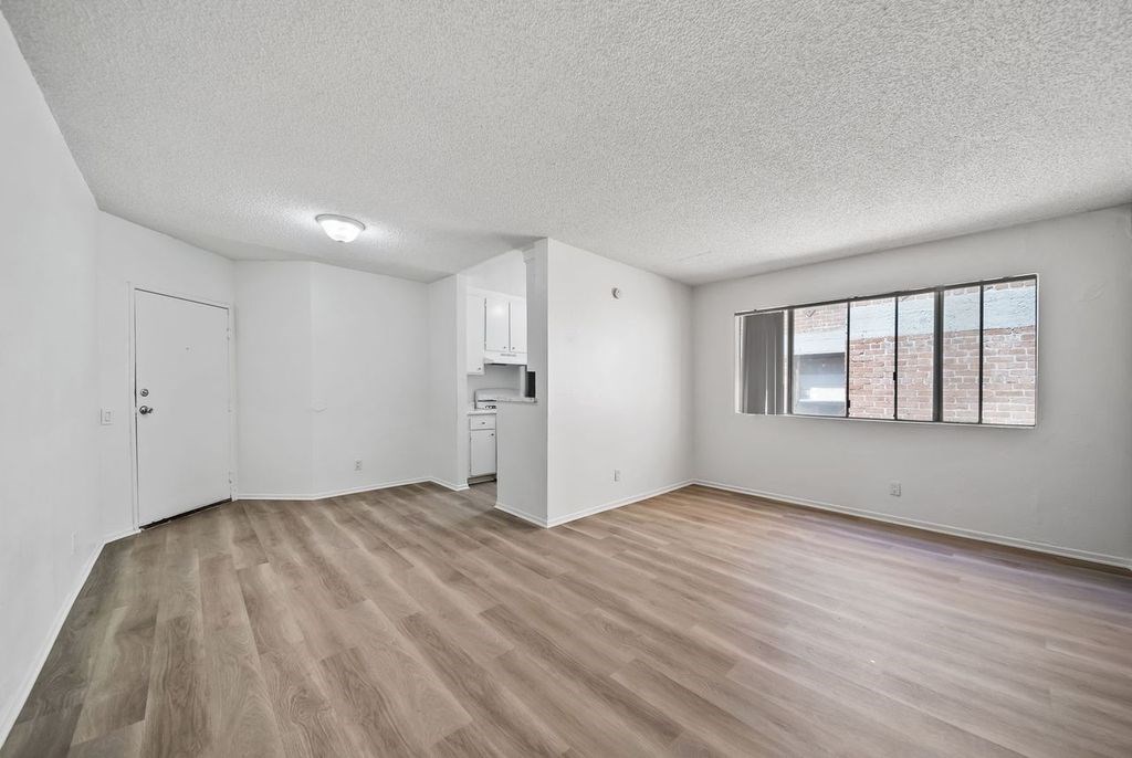 A room with a washer and dryer in it.