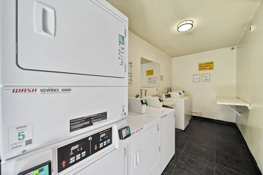 A laundry room with a washing machine and a dryer.