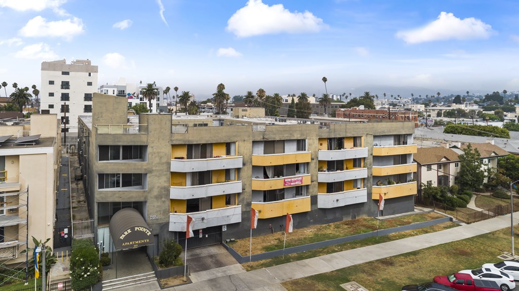 A large building with a yellow and white exterior.