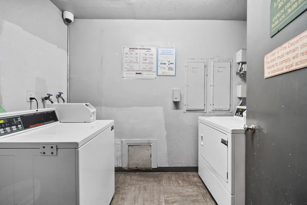 A laundry room with a washer and dryer.