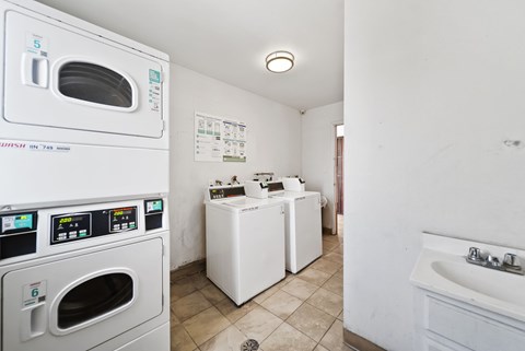 A small laundry room with a washer and dryer.