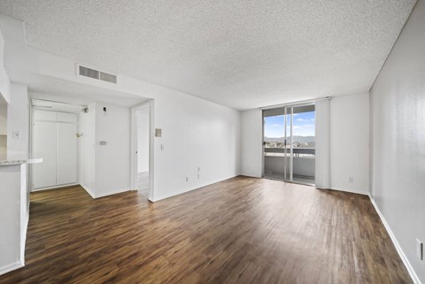 A room with wooden floors and white walls.