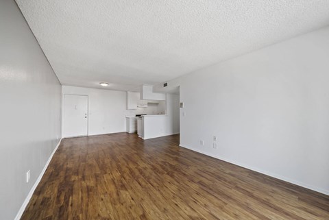 A room with wooden floors and white walls.
