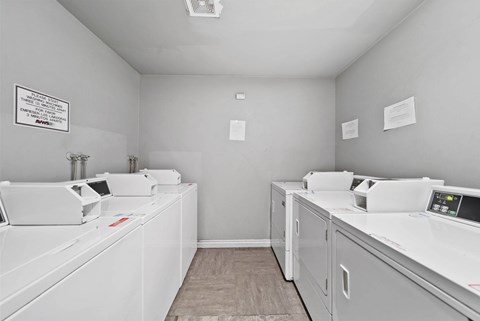 A laundromat with washers and dryers.