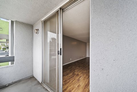 A room with a white door and a window.