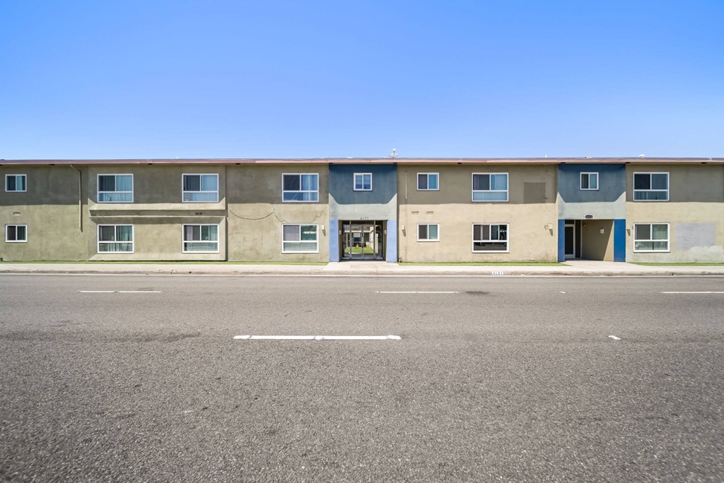 A building with a blue door and windows.