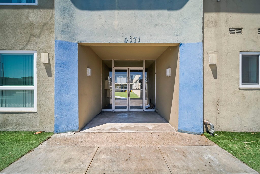 The entrance to apartment 327 is shown with a glass door and a small window on the left.