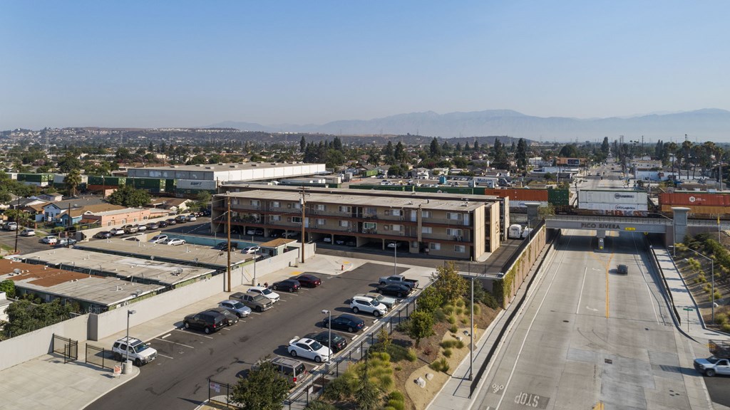 A parking lot with a mountain in the background.