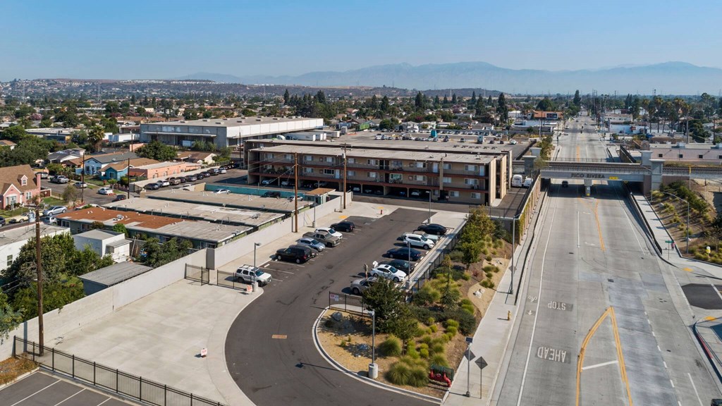 A highway interchange with a building in the background.