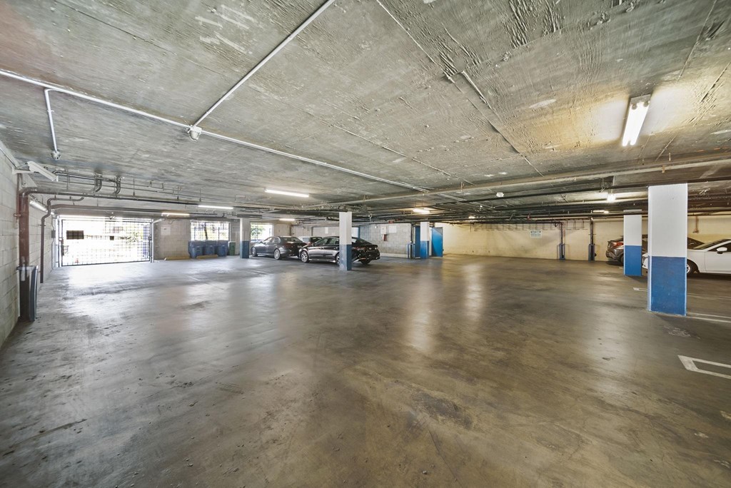 A large, empty parking garage with concrete floors and walls.