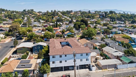 A bird's eye view of a residential area with houses and trees.