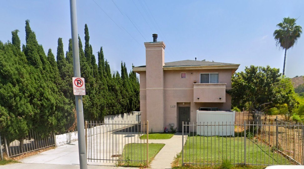 A house with a no parking sign in front of it.