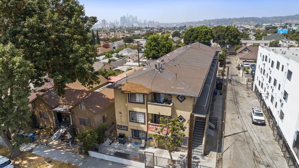 A view of a residential area with houses and a street.