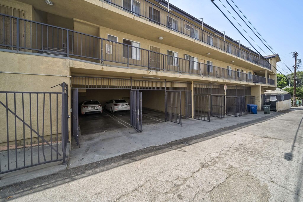 A parking garage with cars parked inside.