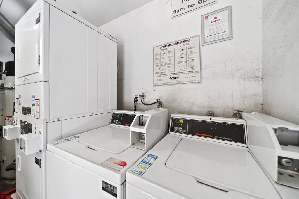 A white washing machine with a control panel on top.