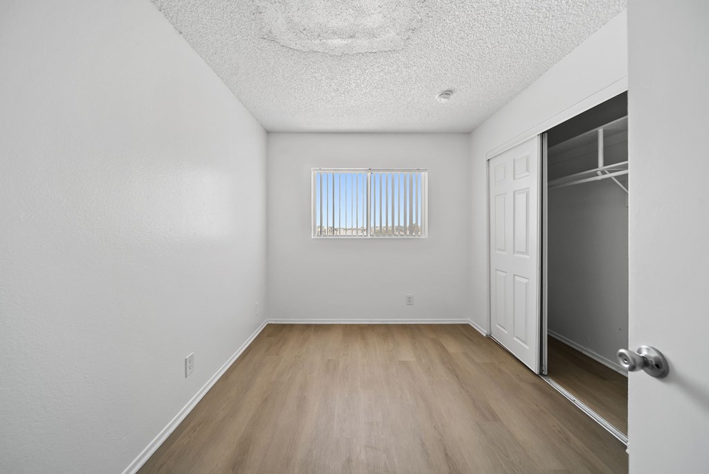 A room with a door and a window.