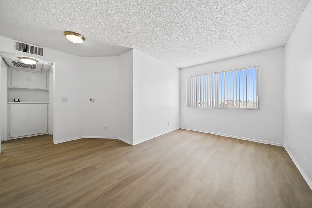 A room with a window and a door.