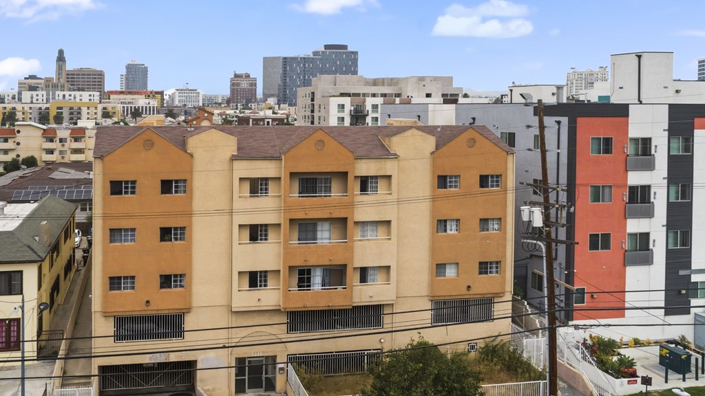 A view of a cityscape with a large building in the foreground.