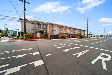 A street with a building and a sign that says "STOP".