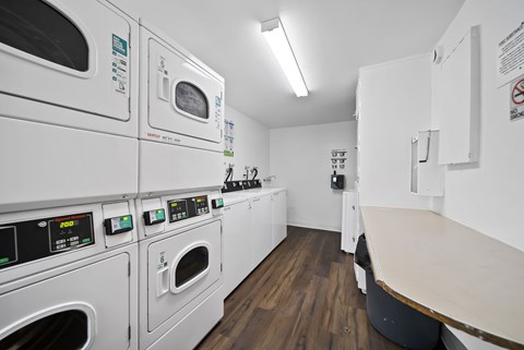 A row of washing machines in a laundromat.