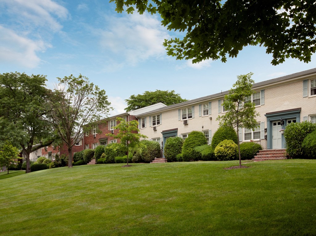 A tree in front of a building at Rivercrest Apartments, Piscataway  08854