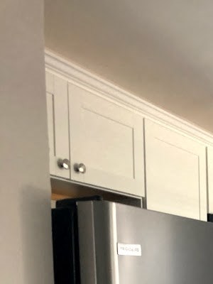 1 bedroom renovated kitchen A kitchen with a stainless steel refrigerator and stove.
